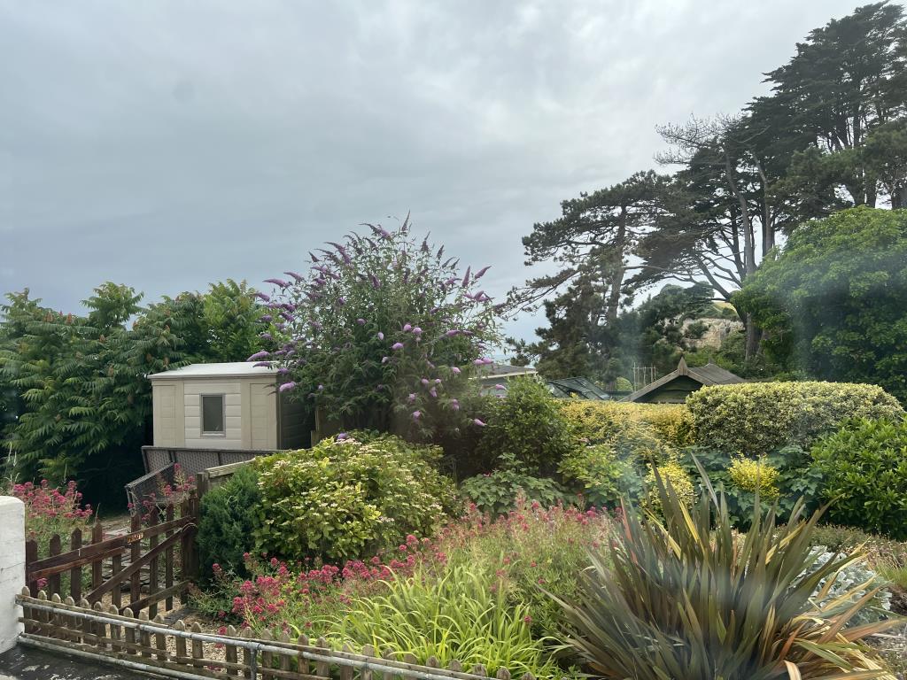 Lot: 91 - GROUND FLOOR FLAT FOR UPDATING - This view is towards Beer Cliffs from the Living room